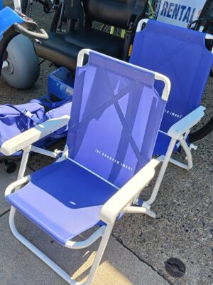 Blue and white beach chairs with a metal frame and comfortable mesh seats. They have a folding mechanism for easy storage. Great at the beach.