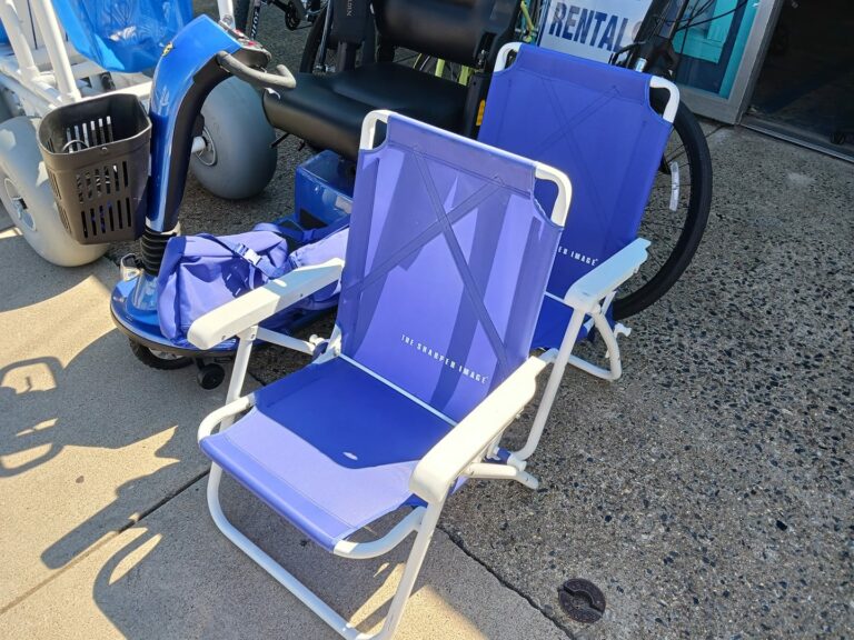 Blue and white beach chairs with a metal frame and comfortable mesh seats. They have a folding mechanism for easy storage. Great at the beach.